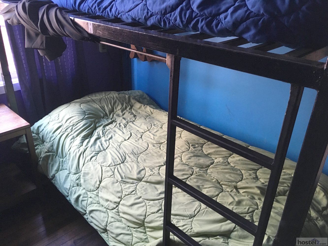Dorm bed with curtains and personal plug socket and light 