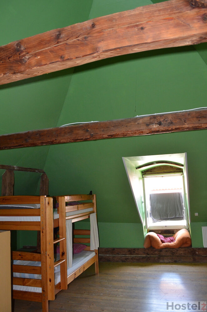 8-bed dorm room on the 2nd floor of the hostel is all made of wood