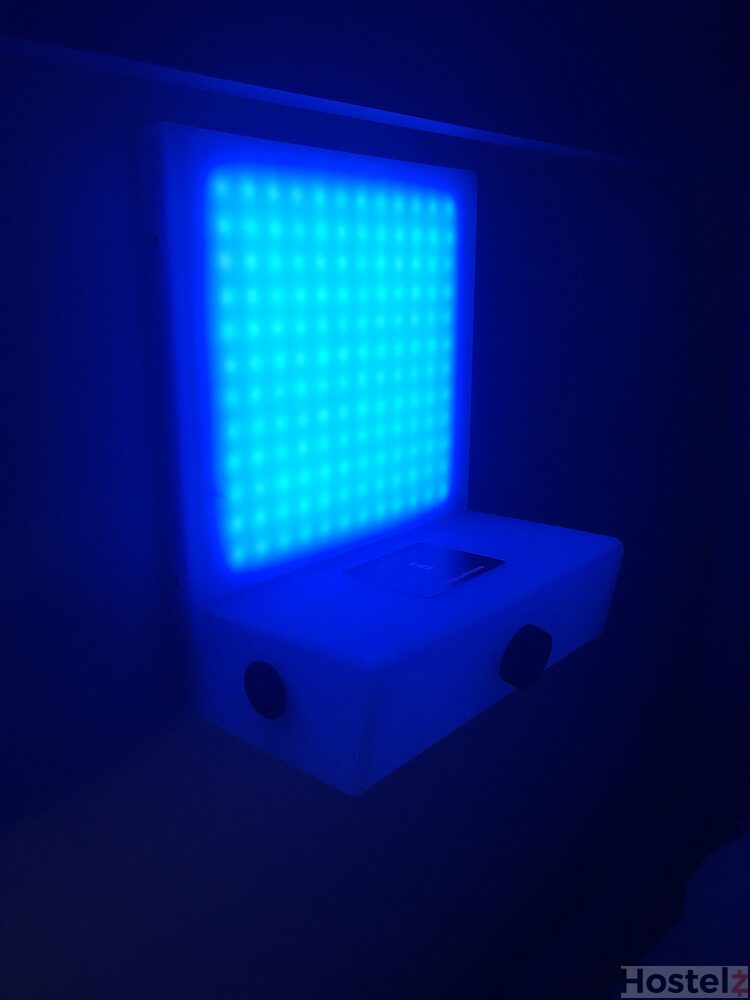 Personal light and charging point by bedside