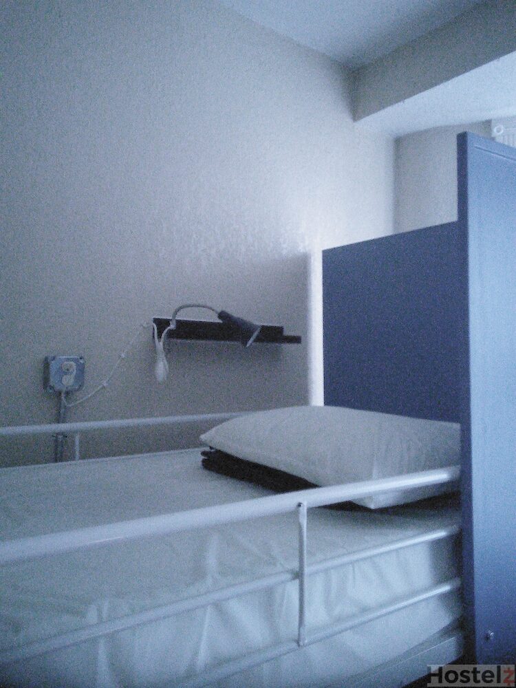 Bedside shelf, mini lamp, outlet and privacy board on every bed