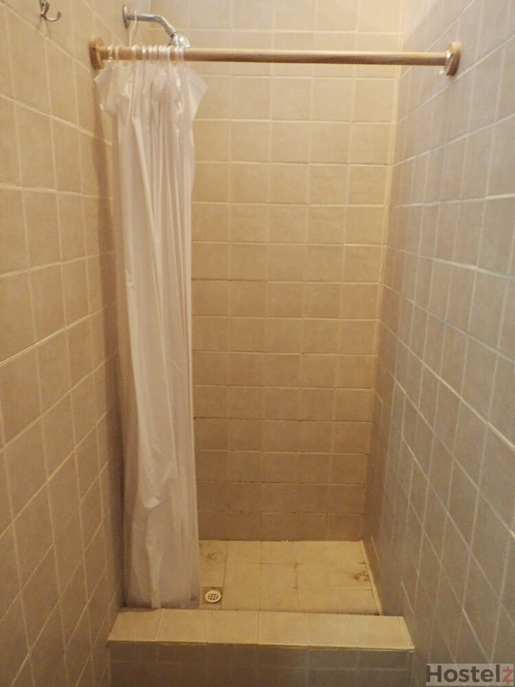 One of the shared showers for the eight-bed dorms